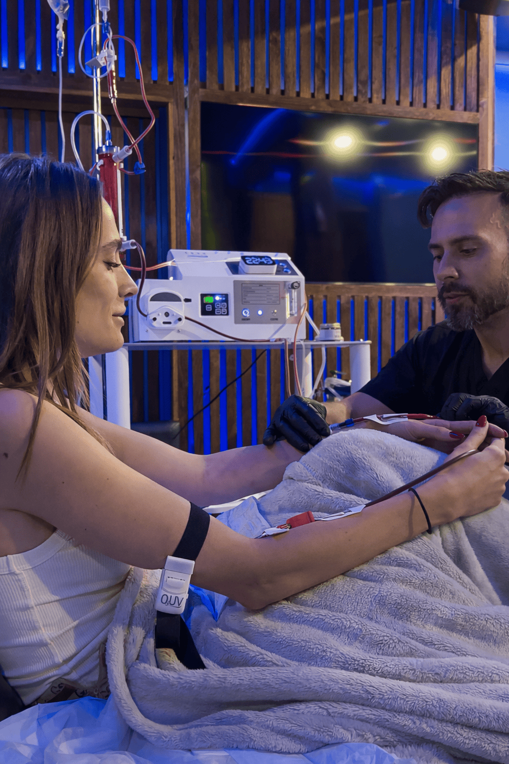 Modern IV therapy session with medical professional in a wellness clinic.